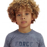 Close-up of a boy wearing a regular fit vintage indigo camo t-shirt with the word FORCE in big on it.