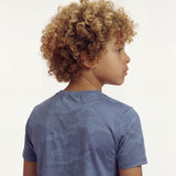 Back close-up view of a boy wearing a regular fit vintage indigo camo t-shirt.