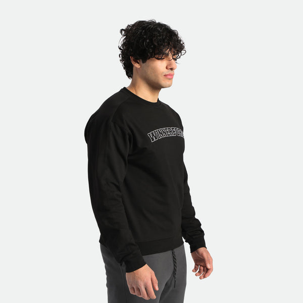 a fit man wearing hoodie black  with pants grey 
