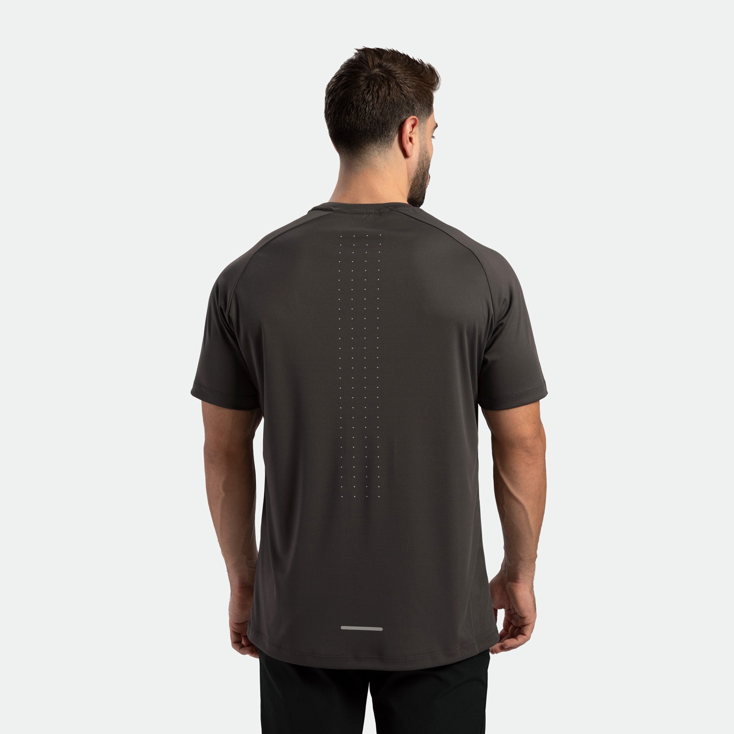 a back view for fit man wearing t-shirt dark grey with pants black 