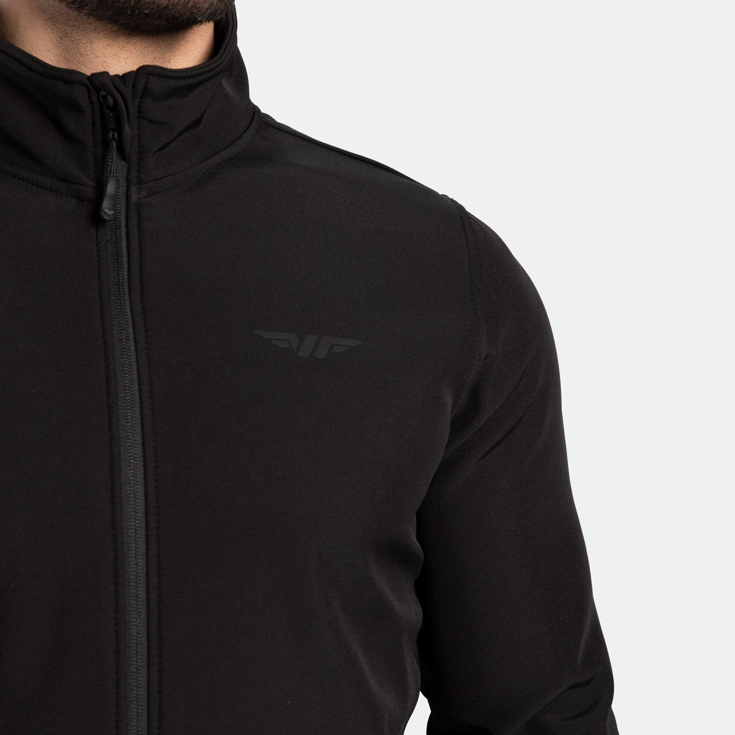 close up view for fit man wearing jacket black with logo 