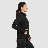 a it woman stand at right and wearing matching set  jacket and legging 