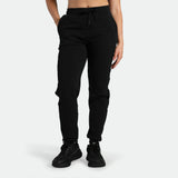 a fit woman wearing black jogger pants ,plus the shoes 