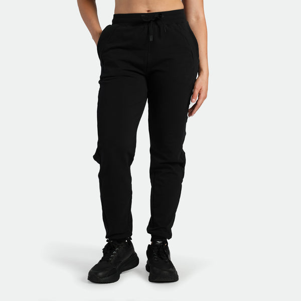a fit woman wearing black jogger pants ,plus the shoes 