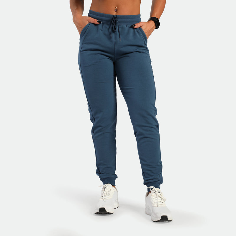 a fit woman wearing jogger pants blue 