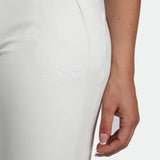 close up view for fit man wearing jogger pants cloud grey with logo 