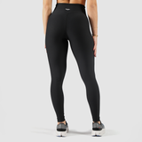 a back view for woman wearing legging black and logo with background light grey