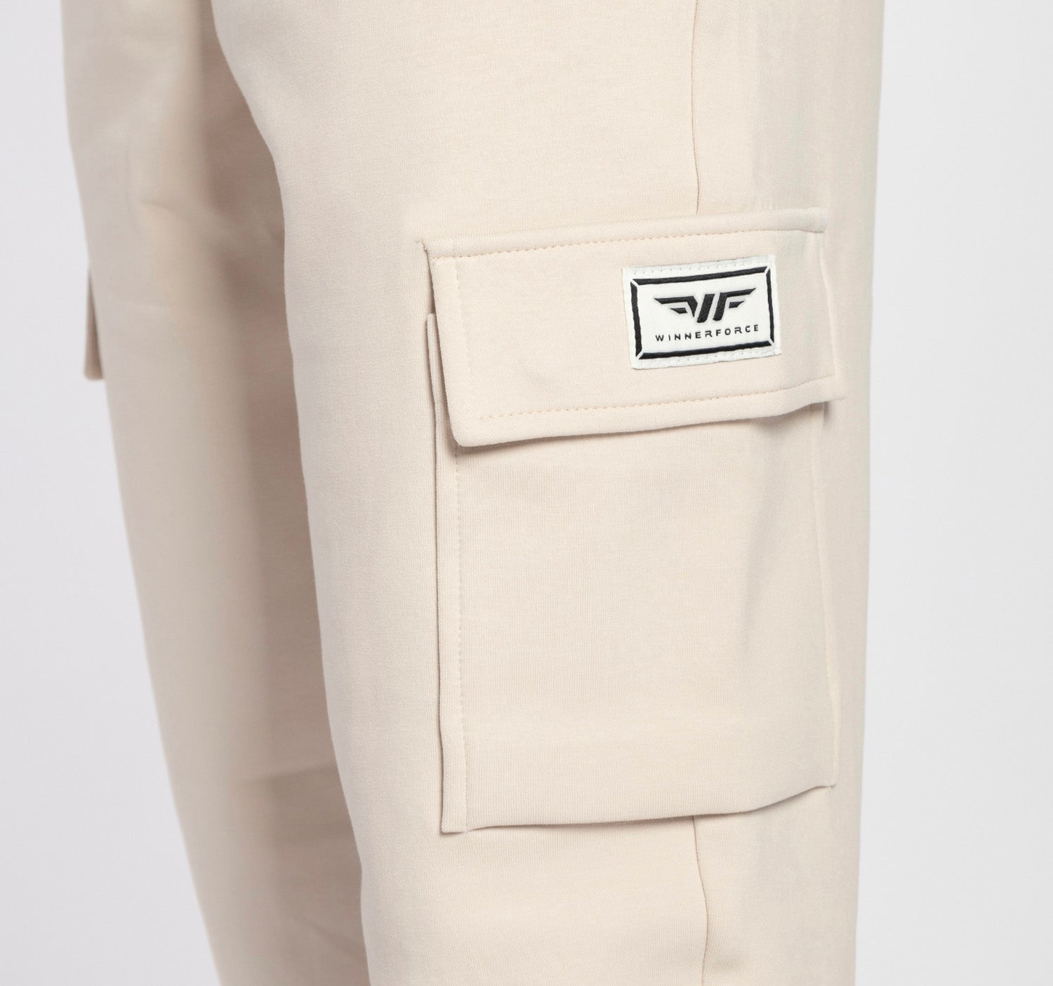 close up view for pocket of pant  light beige  with logo 