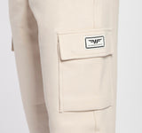 close up view for pocket of pant  light beige  with logo 