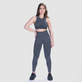 a women wearing  matching bra sports and legging ,same logo and color(grey)
