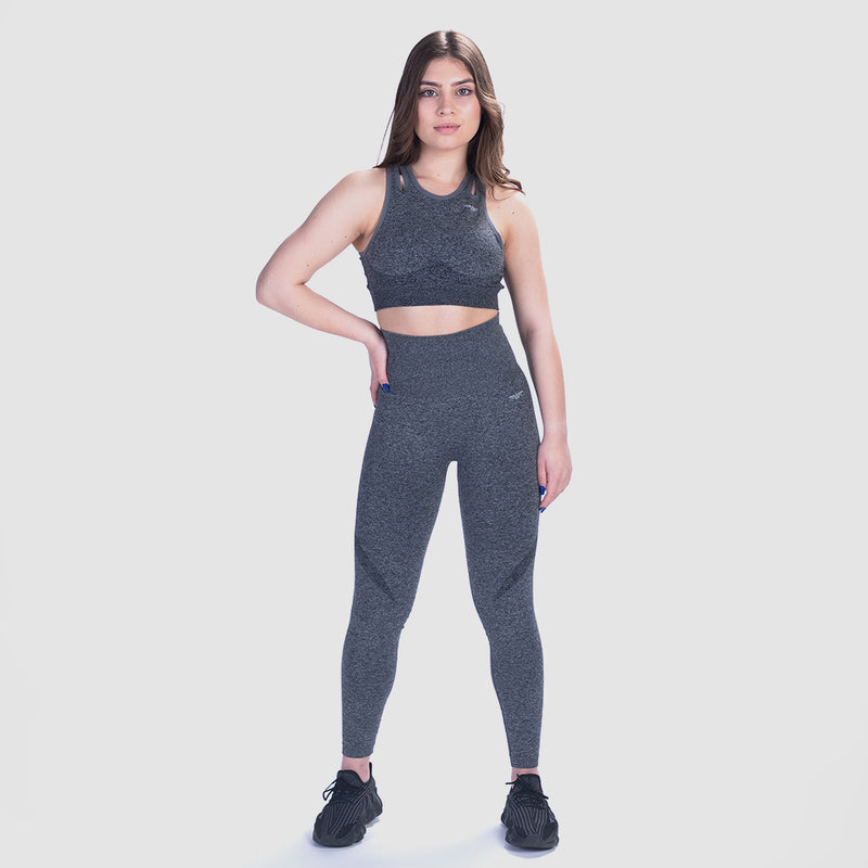 a women wearing  matching bra sports and legging ,same logo and color(grey)