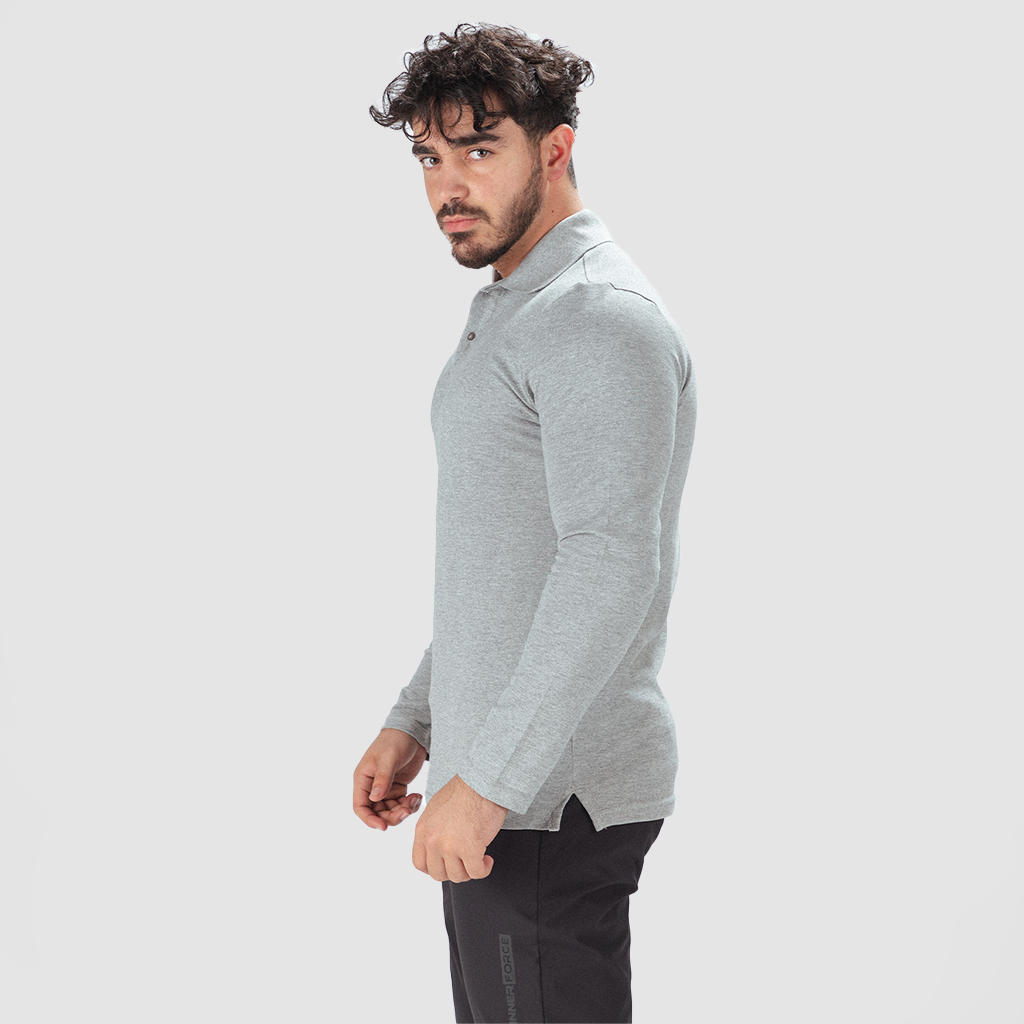 a fit man stand at right and wearing sleeve t-shirt grey with pants black 