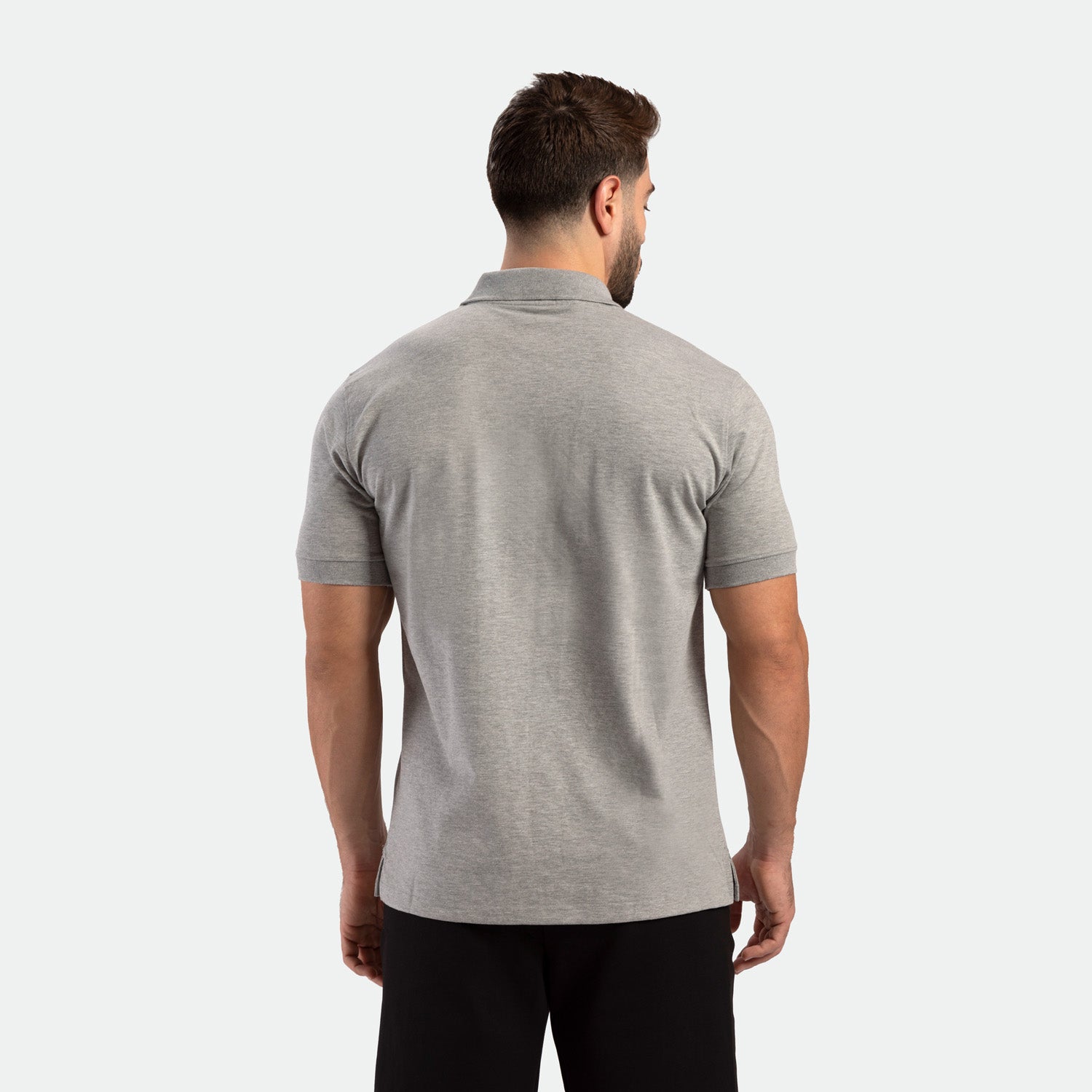 a back view for fit man wearing t-shirt light grey with  short black 