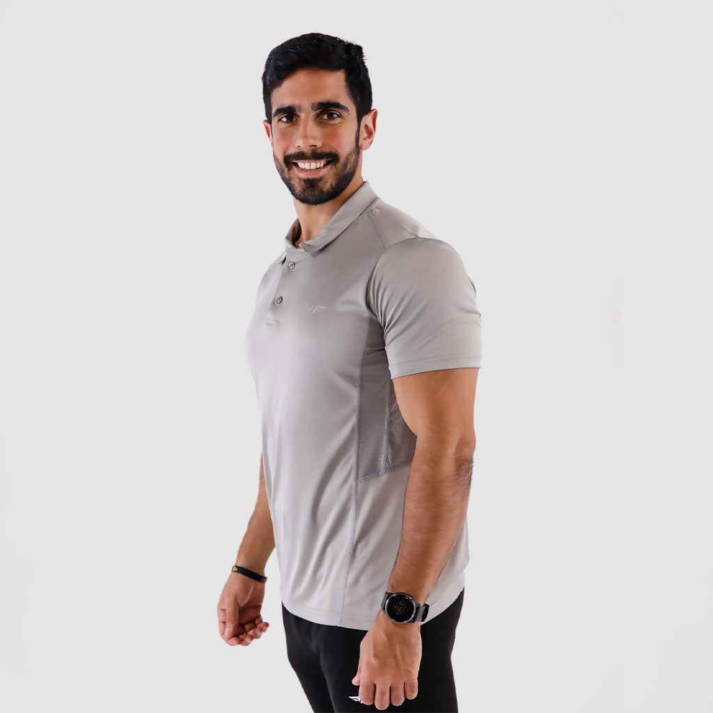a fit man stand at ight and wearing t-shirt light grey with pants black 