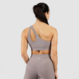 a back view  for woman wearing  a grey sports bra and legging ,plus logo and background  light grey 