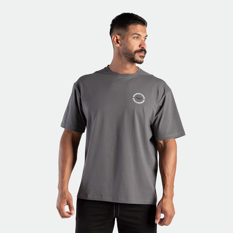a fit man wearing t-shirt magnet dark grey with short  black  