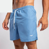 close up view for fit man wearing short marina blue with logo