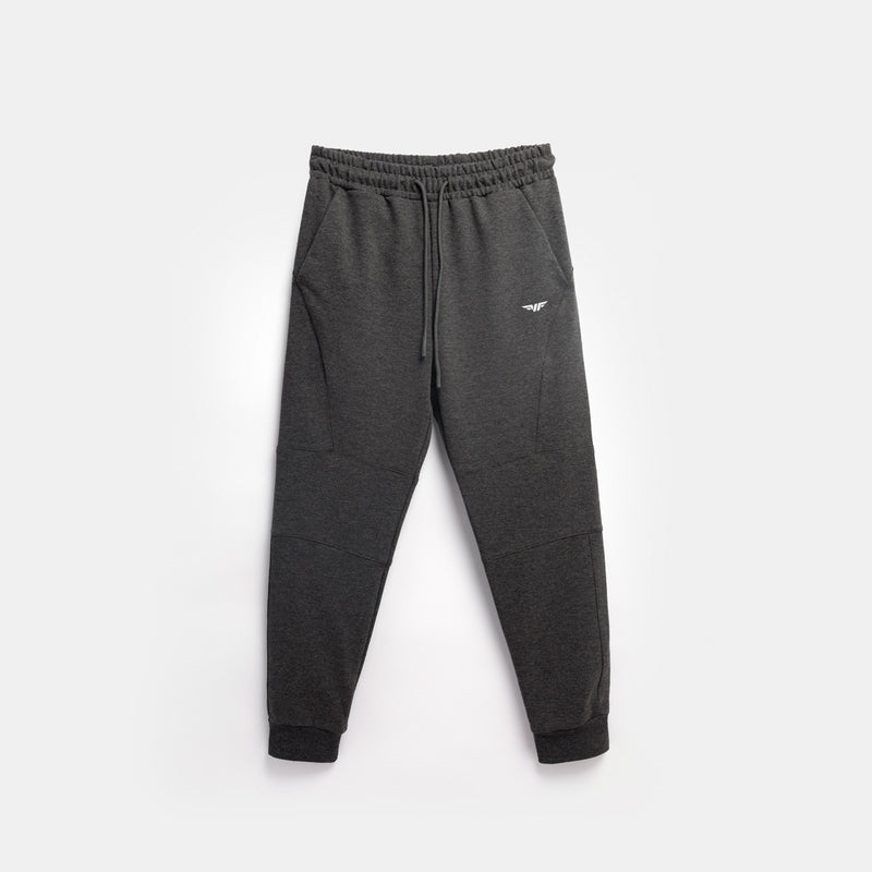 Dark gray jogger pants with an elastic waistband and cuffed ankles, featuring a small logo on the left thigh. The pants are laid flat on a light gray background.