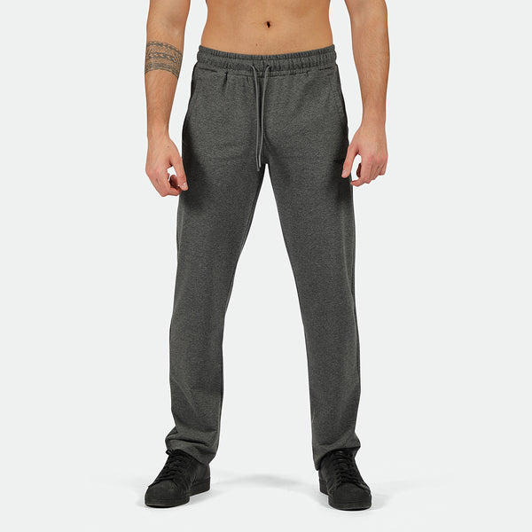 a fit man wearing pants marl dark grey with shoes black 