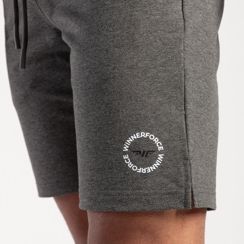 close up view for fit man wearing short marl dark grey with logo 