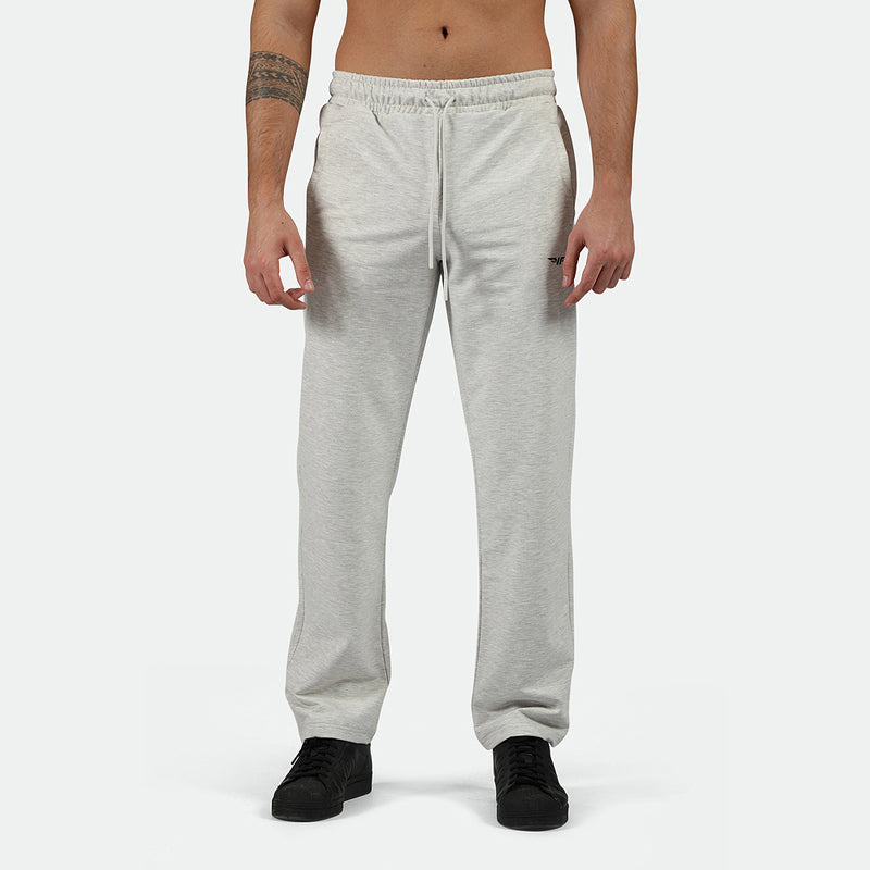 a fit man wearing pants marl light grey with shoes black 