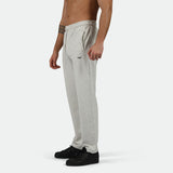 a fit man stand at right  and wearing pants  marl light grey with shoes black