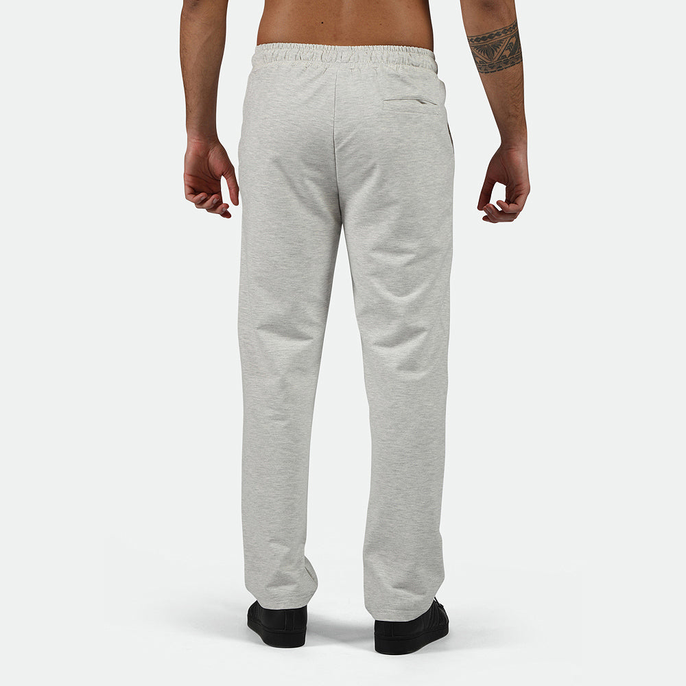 a back view for fit man wearing pants  marl light grey with shoes black 