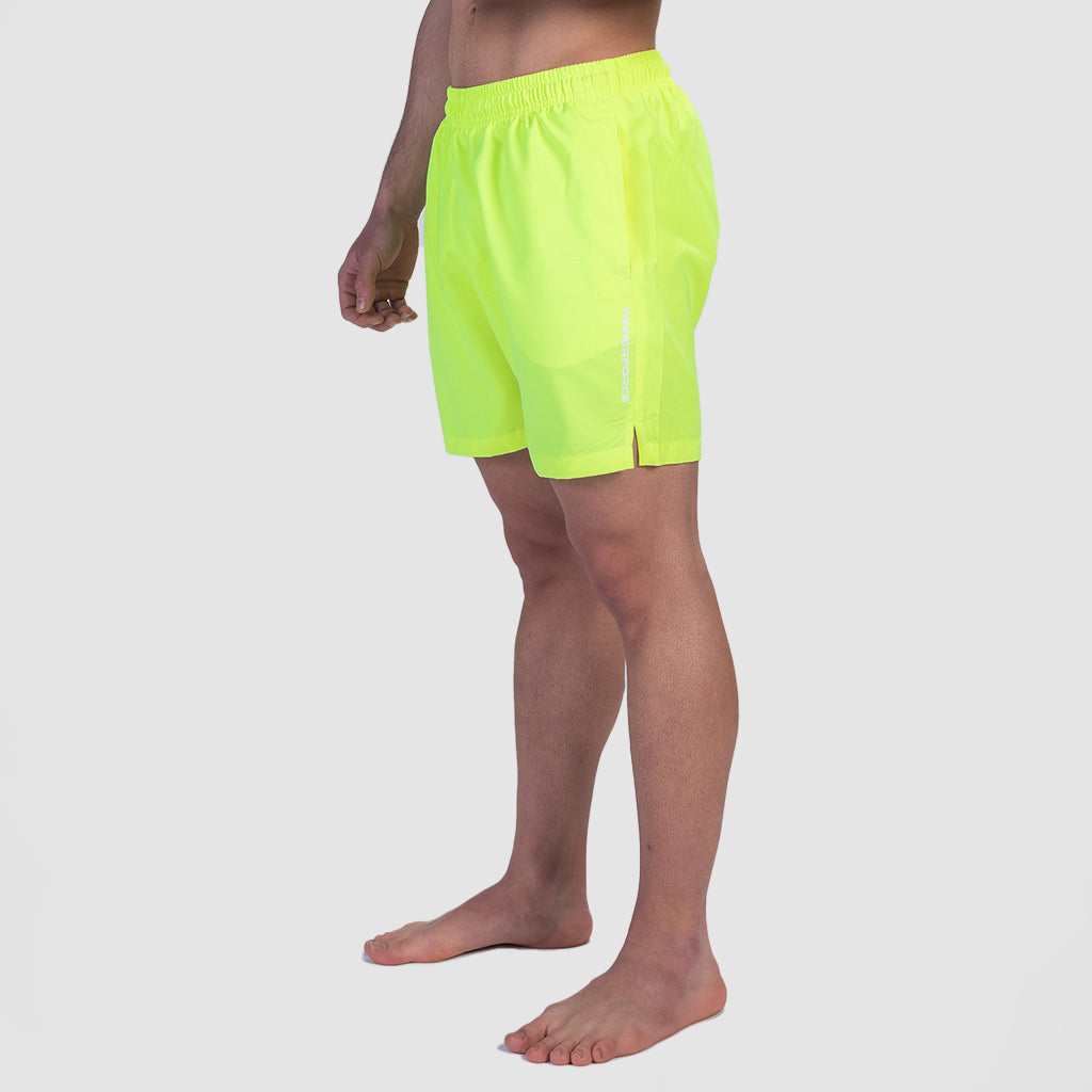 a fit  man wearing short  neon yellow 