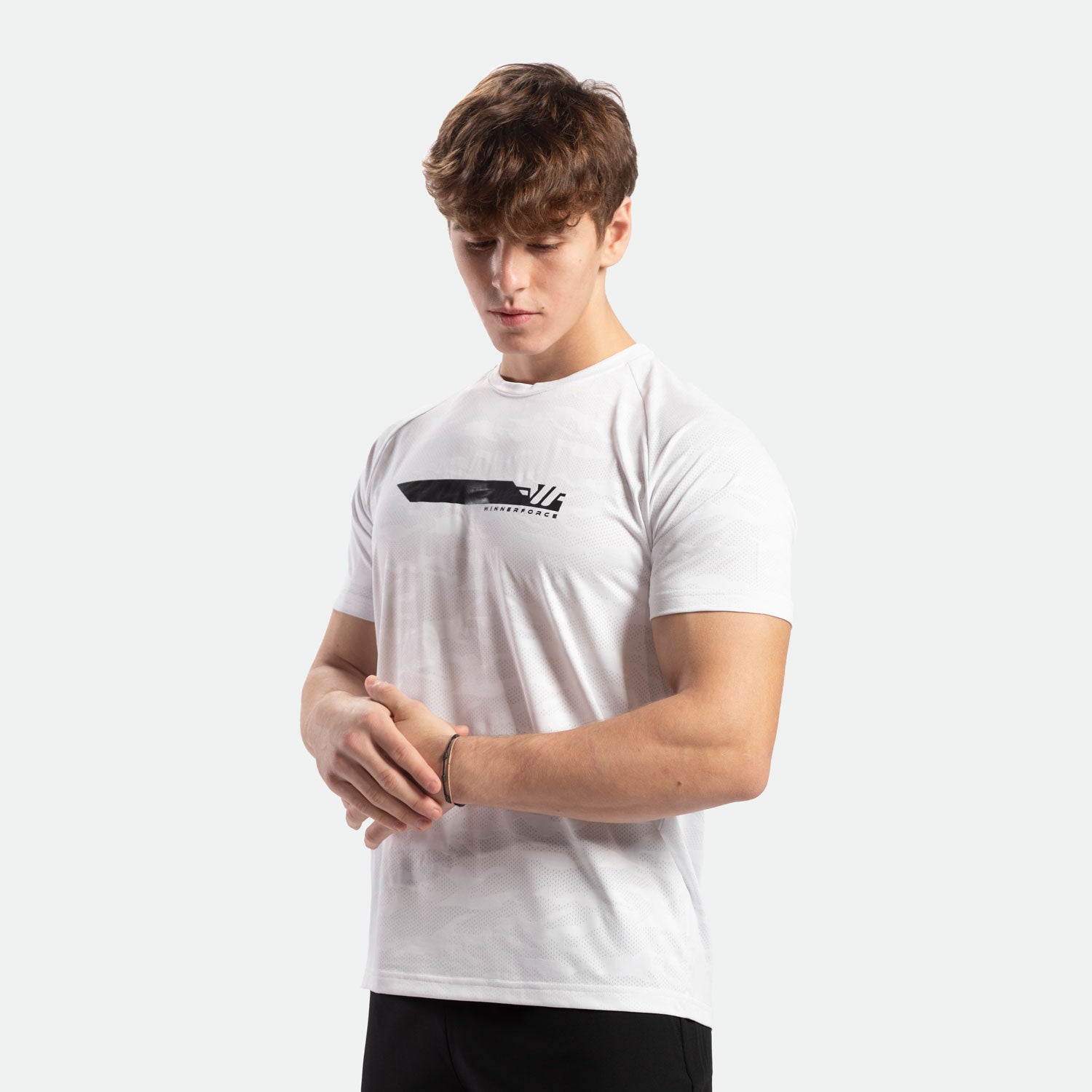 a fit man wearing camo  t-shirt white with pants black 