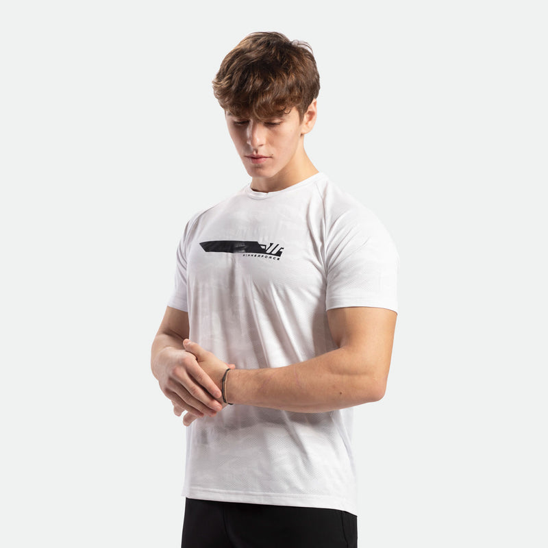 a fit man wearing camo  t-shirt white with pants black 