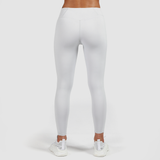 a back view for woman wearing legging  grey and shoes white, plus the background is light grey 