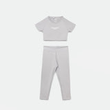 a matching set  grey crop top with logo and legging 