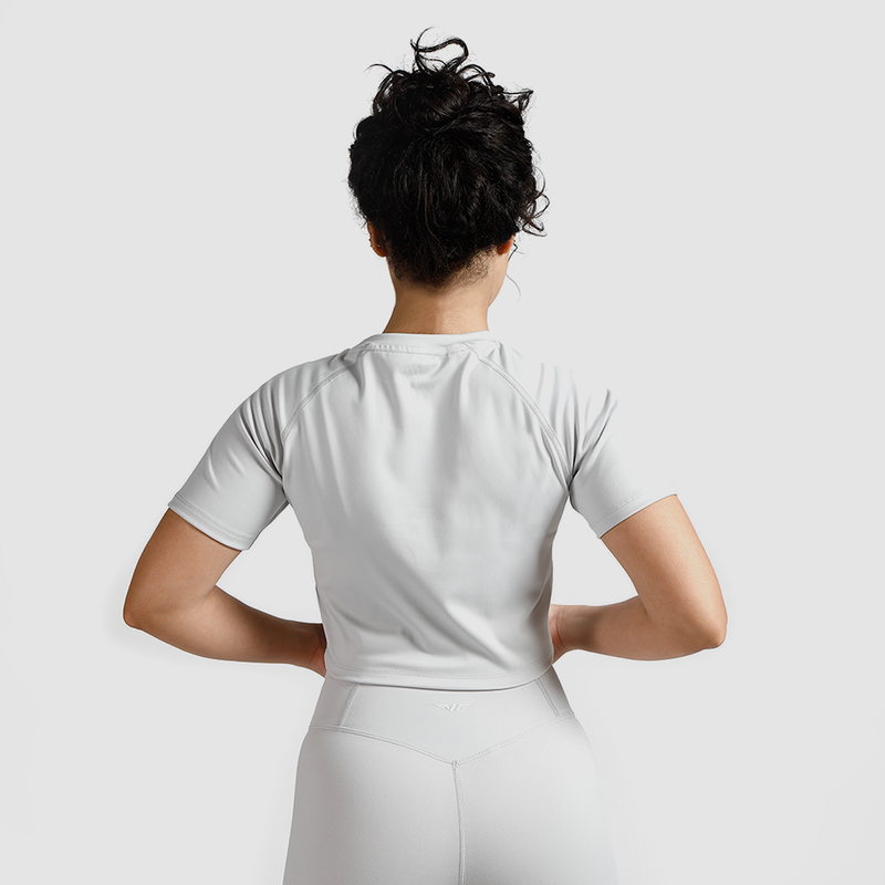 a back view for fit woman wearing  matching set crop top grey with short 