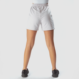 a back view for fit woman wearing marl light grey with shoes black ,plus the background is light grey 