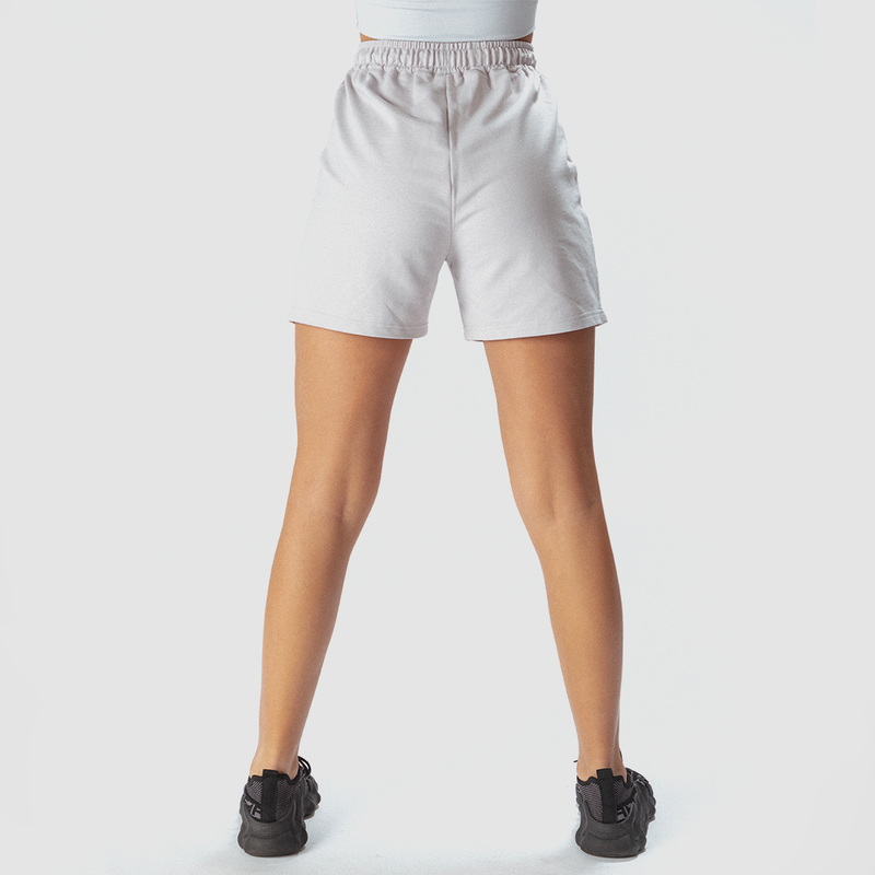 a back view for fit woman wearing marl light grey with shoes black ,plus the background is light grey 