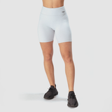  a fit woman wearing short grey with logo and sneakers black 