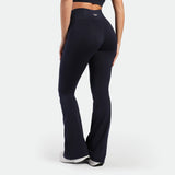a back view for fit woman wearing legging flared legging navy with shoes