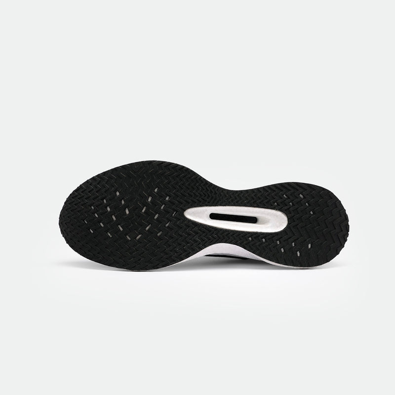 The black sole of a sneaker featuring a herringbone tread pattern on a clean white background. The design suggests durability and grip.