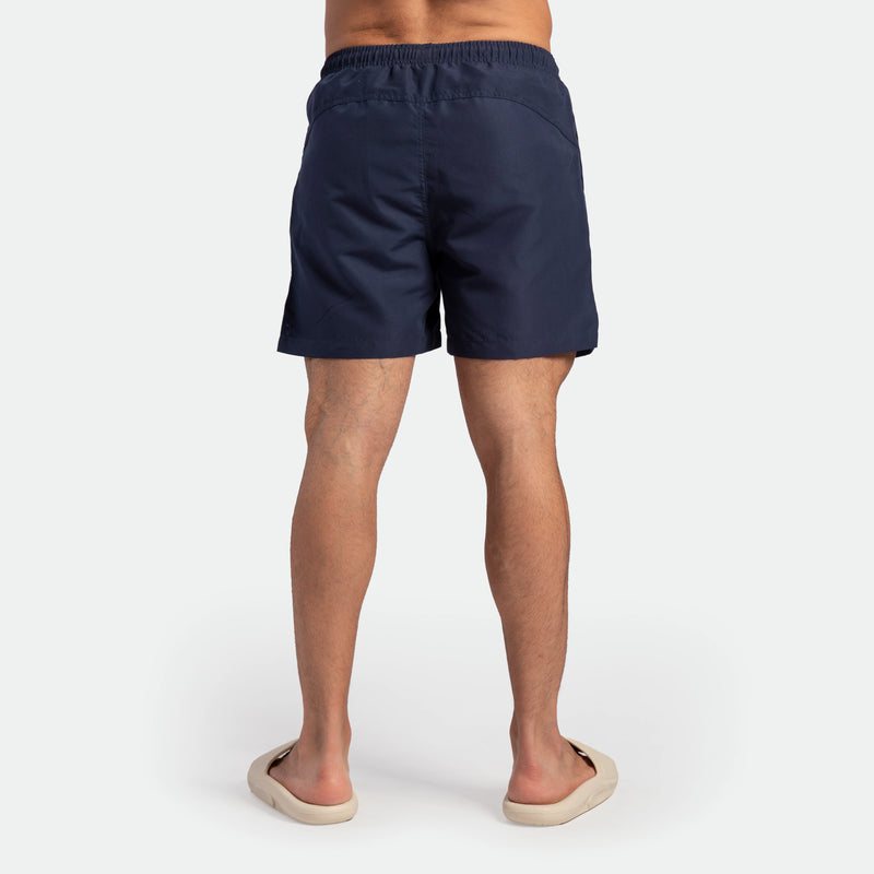 a back view for fit man wearing short navy blue 
