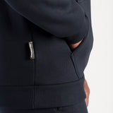 Close-up of a dark blue hoodie with a label.