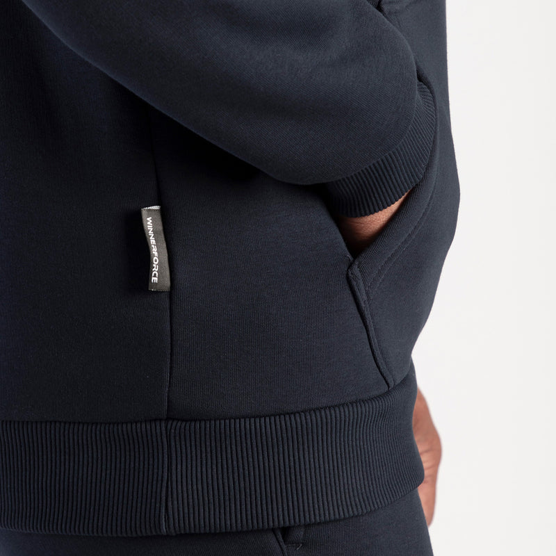 Close-up of a dark blue hoodie with a label.