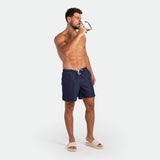 a fit man stand with pose and wearing short navy blue 