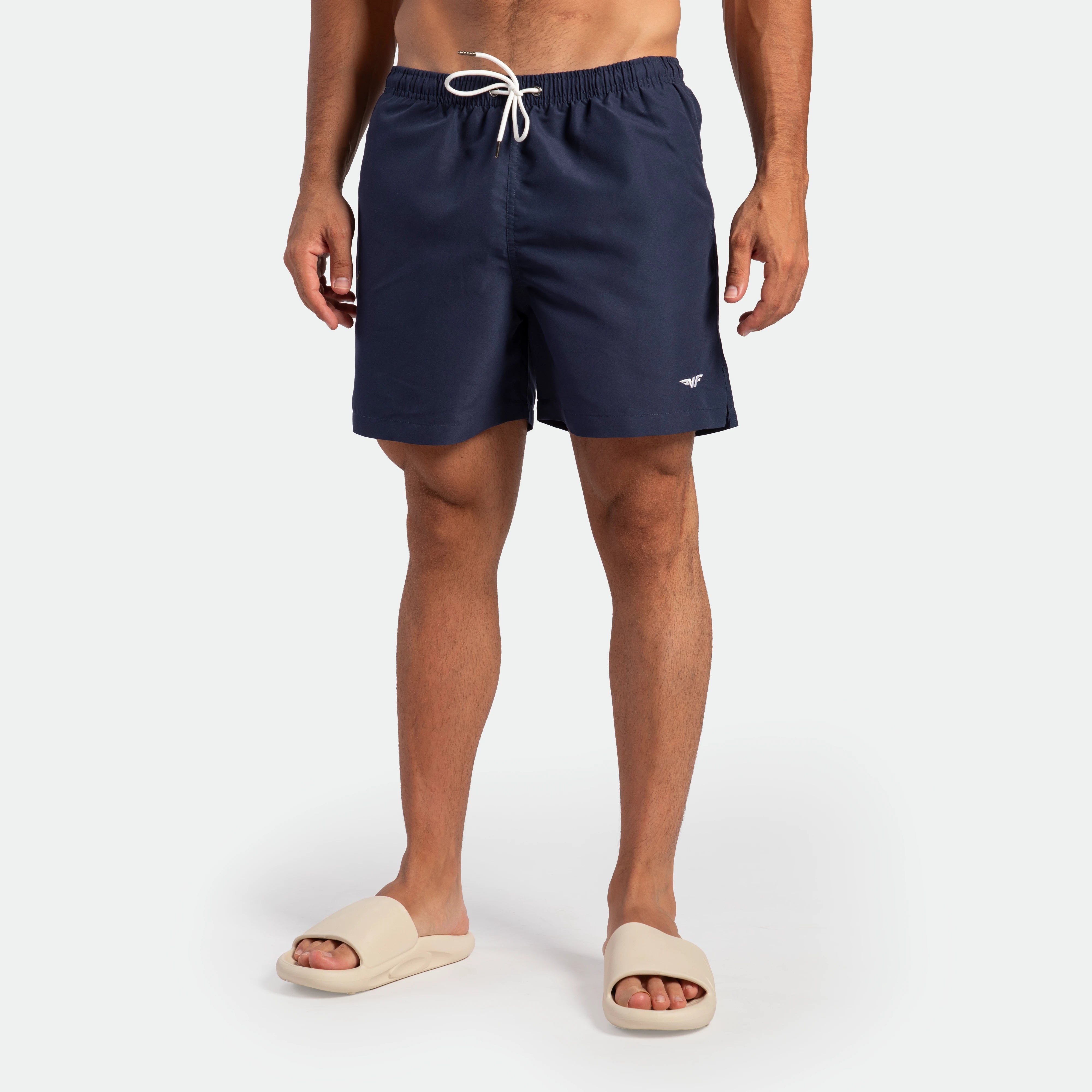 a fit man wearing short navy blue 