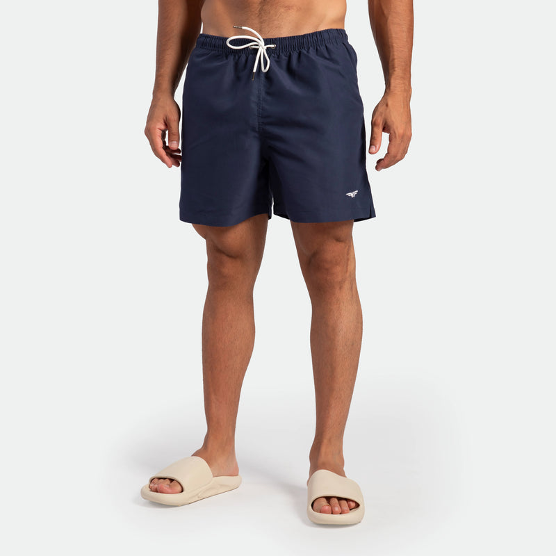 a fit man wearing short navy blue 