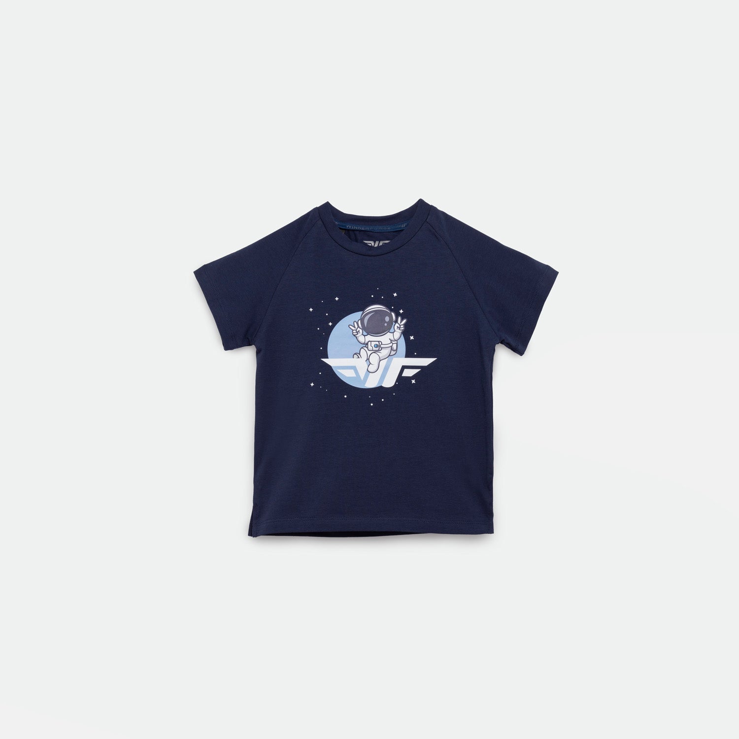 Navy blue short-sleeved t-shirt featuring a graphic of an astronaut floating in space with stars around, set against a circular blue background. The astronaut is positioned above a stylized wing logo.