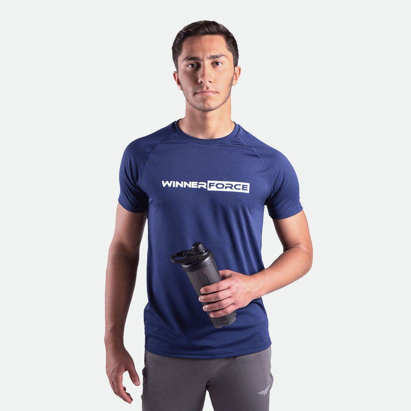 a fit man wearing t-shirt navy blue with logo and pants grey 