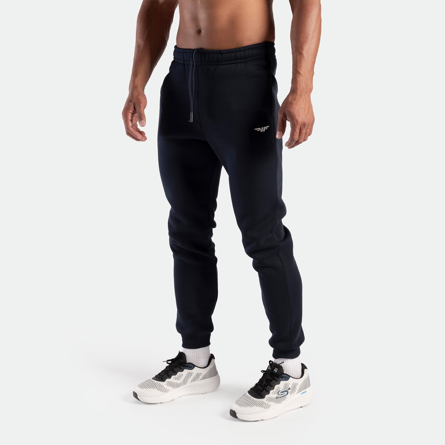 a man wearing pants navy with socks white and shoes sports 