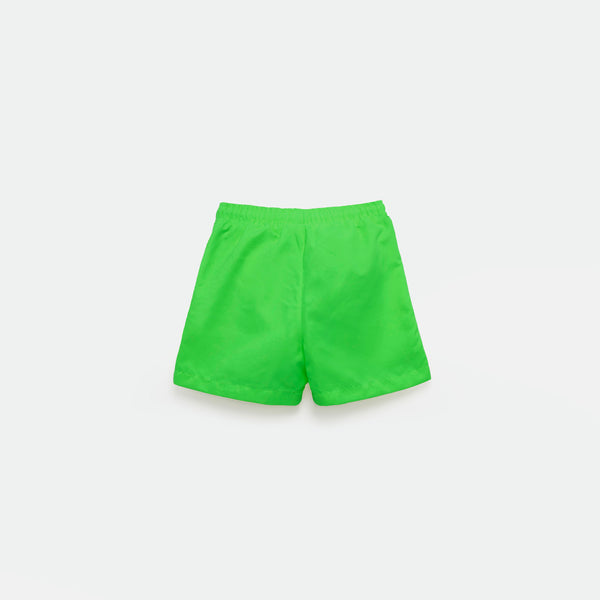 a back view  for short bright green with background light grey 