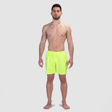 a fit man wearing short neon green 