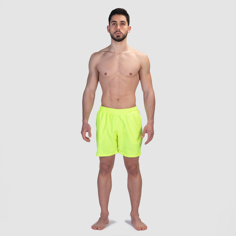 a fit man wearing short neon green 